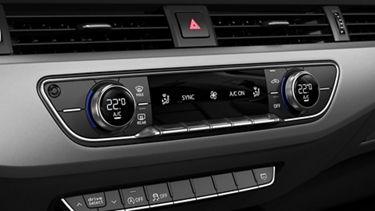 Car climate control system with digital temperature display set to 22 degrees Celsius.