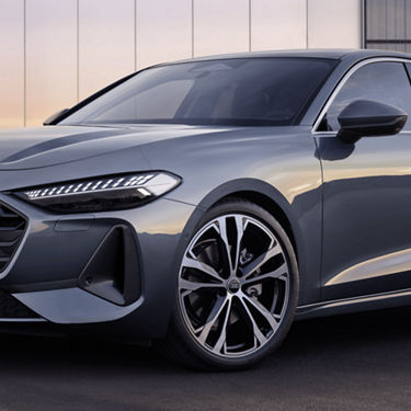 A grey Audi A5 Saloon with sleek headlights and alloy wheels.