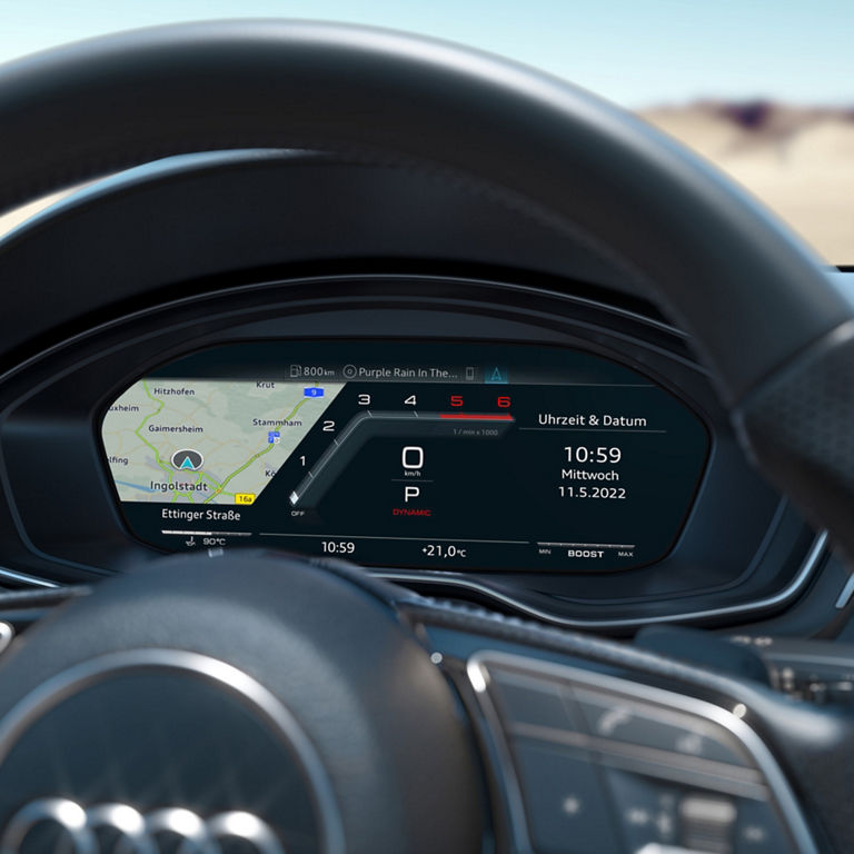 Car digital dashboard displaying speedometer, navigation map, time, and exterior temperature.