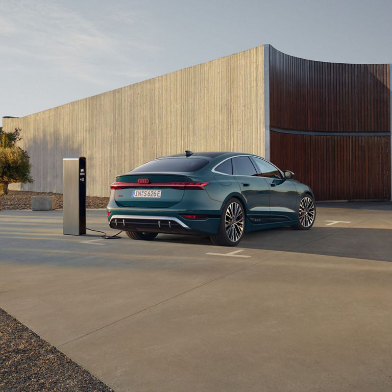 Car charging at a modern charging station.