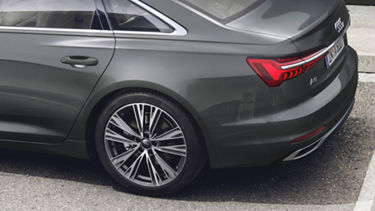 The rear view of the sedan, showcasing its sleek design and modern features.