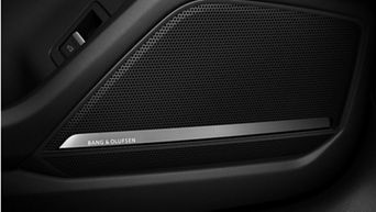 Car door speaker grille with "BANG & OLUFSEN" branding.