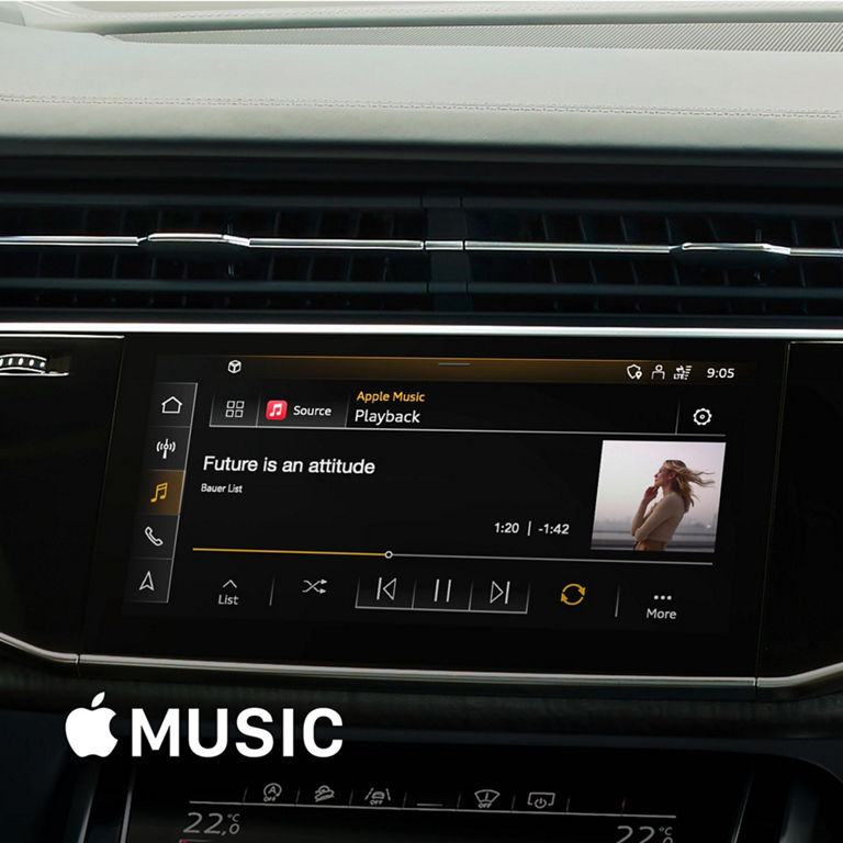 Car interior with a digital display showing Apple Music interface.