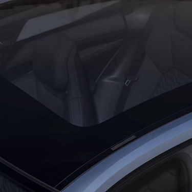 Interior view of a car showing leather seats from above.