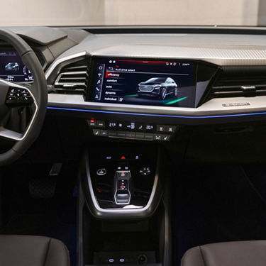 Close up of dashboard showing touchscreen panel inside Audi Q4 Sportback e-tron.