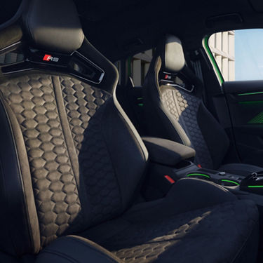 Audi RS3 Sportback car interior with quilted leather bucket seats and modern design accents.