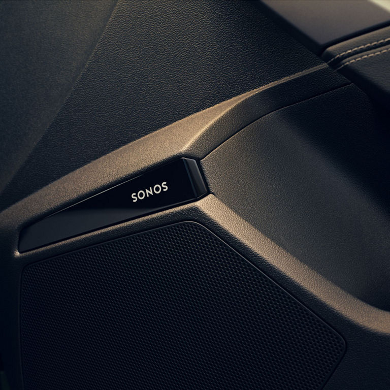 Close-up of a textured Sonos speaker detail with brand logo.