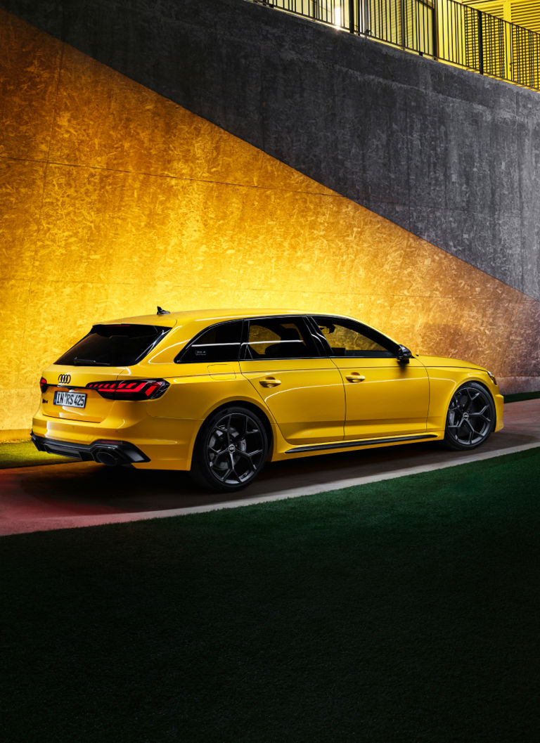 A yellow Audi RS4 Avant stands out, emphasizing its dynamic lines and performance-oriented design.