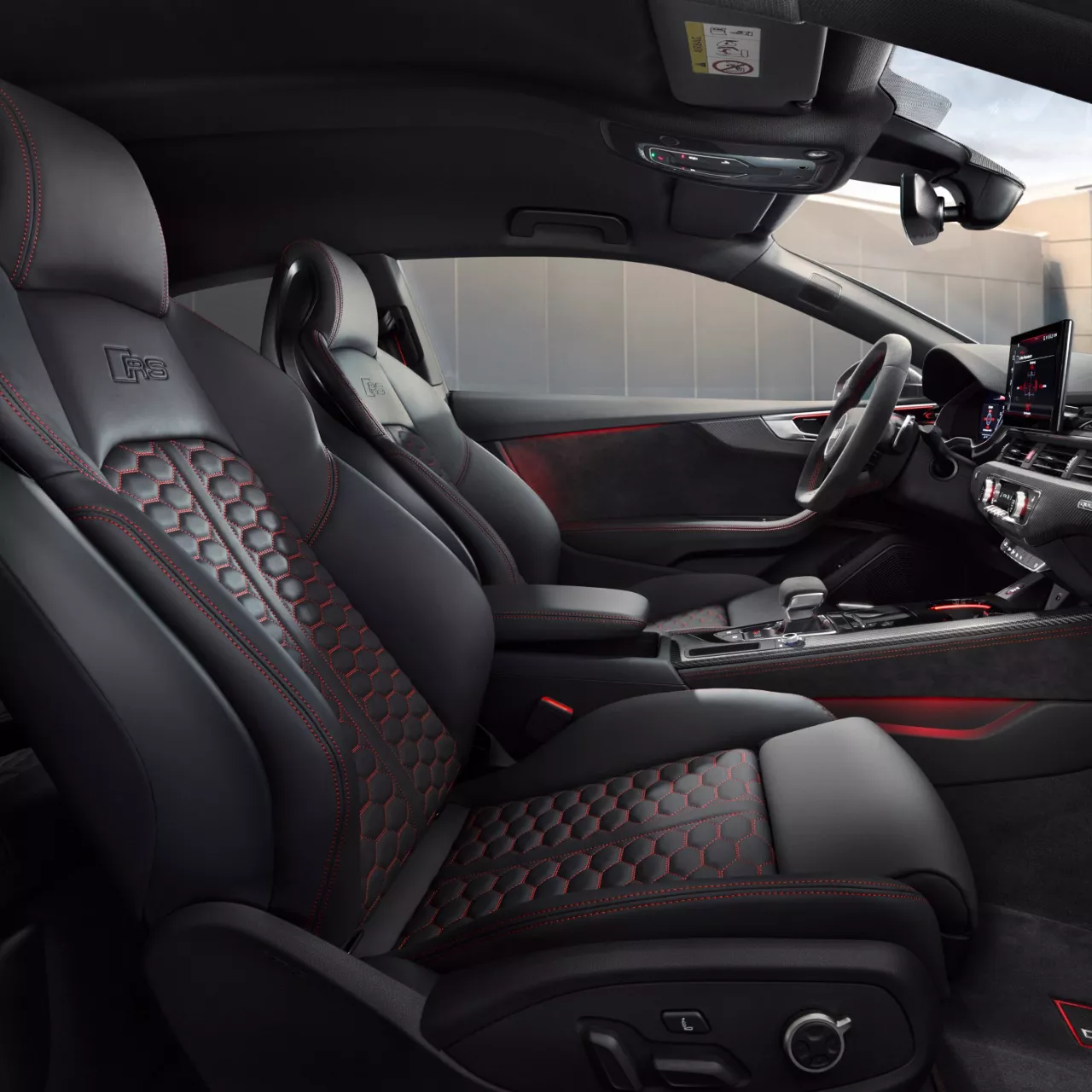 Car's interior with leather seats, modern dashboard, and center console.