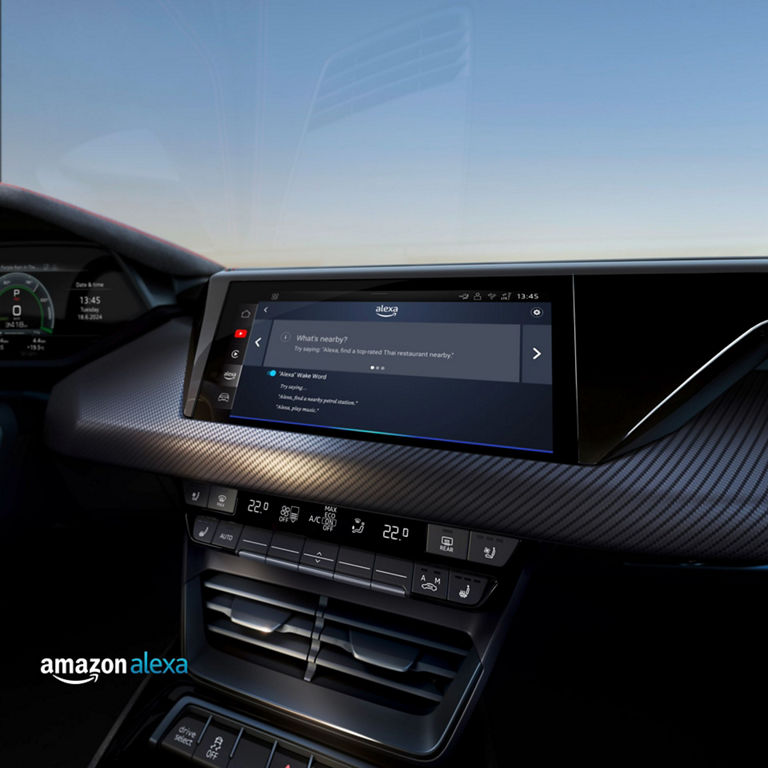 Car dashboard with integrated Amazon Alexa interface displaying voice commands.