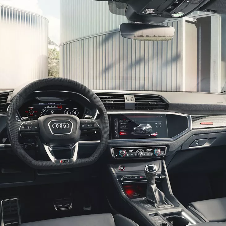 Interior view of Audi Q3 parked in a yard.