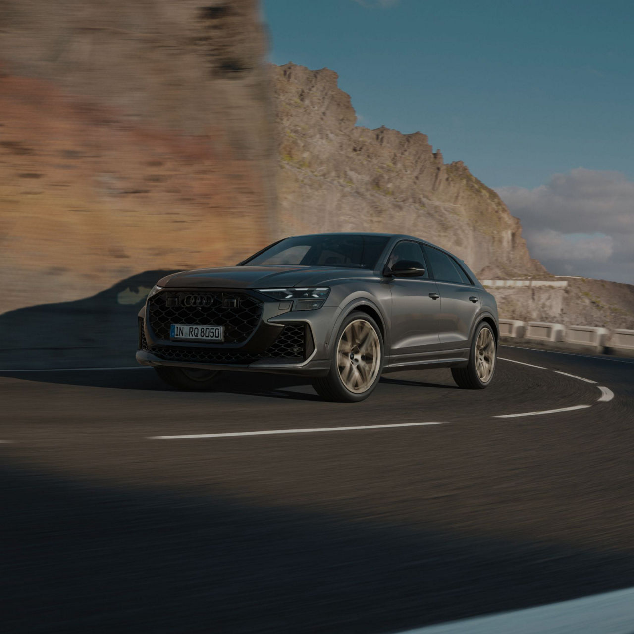 Audi RS Q8 Performance driving up a mountain slope.