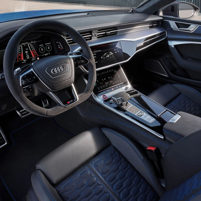 Audi RS Q8 Performance interior view of controls and steering wheel.