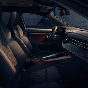  Audi S3 car interior with leather seats, modern dashboard, and ambient lighting.
