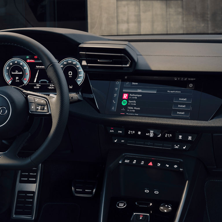 Audi S3 car interior with a digital dashboard and touchscreen infotainment system.