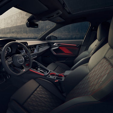  Audi S3 Sportback car interior with leather seats and modern dashboard.