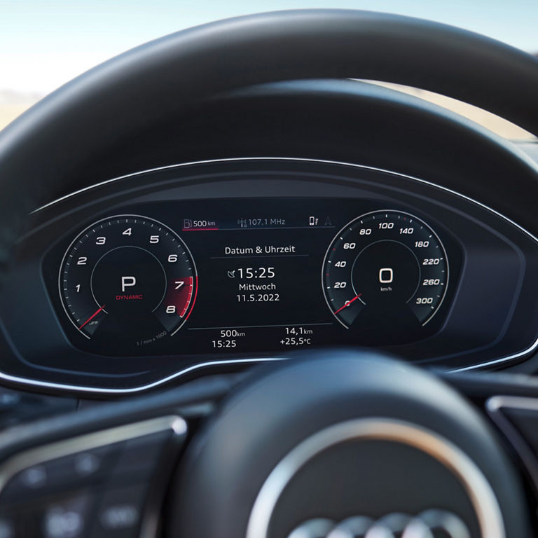 View from a car's interior driving towards a skyline with a heads-up display showing speed at dusk.