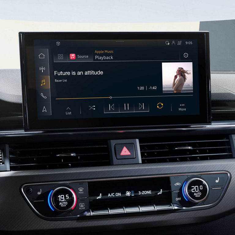 Car infotainment screen displaying music player.