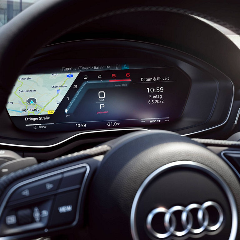 A car's digital dashboard displaying navigation map, speedometer, and multimedia information.