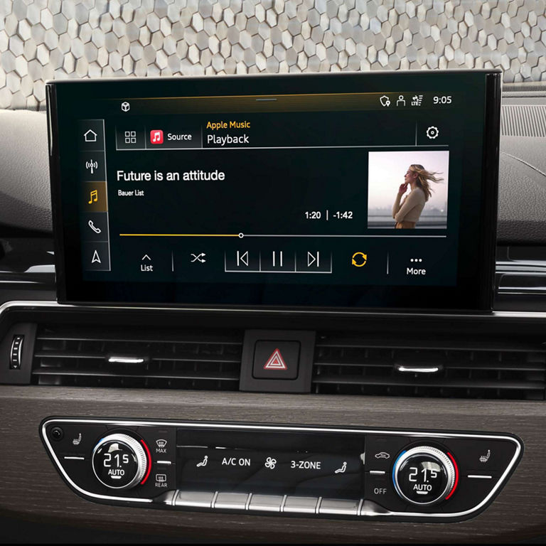 Car's multimedia system screen displaying music