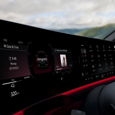 Audi car dashboard display with multimedia interface, date, time, and vehicle status indicators.